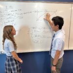 Brandon Wang with a student.
