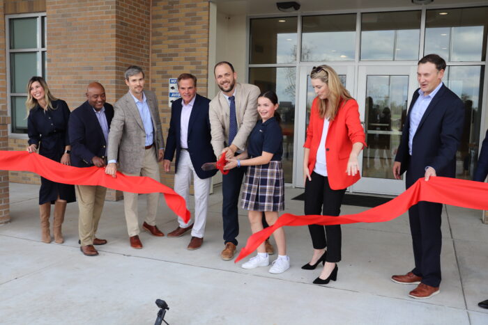 Sam Heisman and key partners cutting ribbon at Great Hearts Harveston