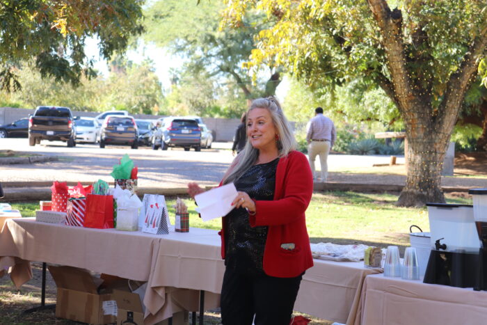 Kathy Lund addressing Office Managers at December celebration