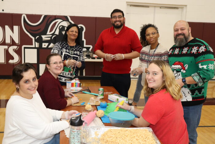 teachers competing in a gingerbread contest
