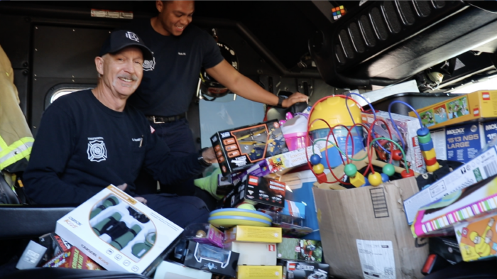 Glendale Fire Fighters with donated toys in the fire engine