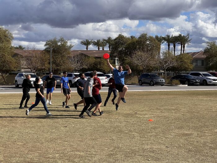 Faculty playing ultimate frisbee