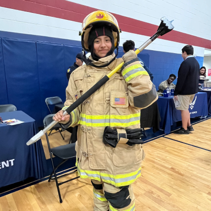 Maryvale student in full fire fighter gear at the College and Career Fair