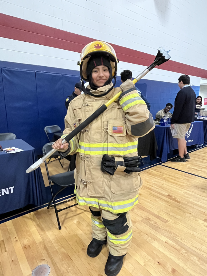 Maryvale student in full fire fighter gear at the College and Career Fair
