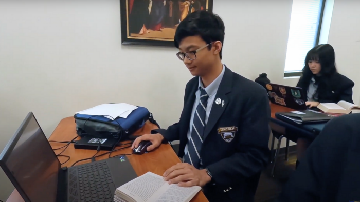 Student working on his laptop