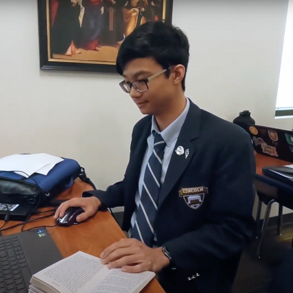 Student working on his laptop