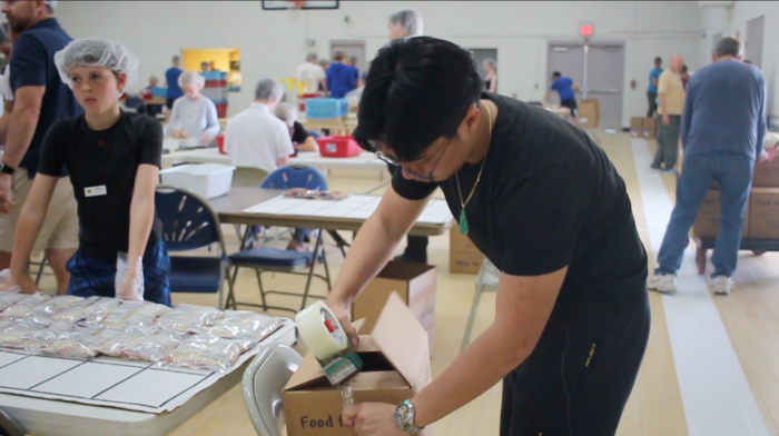 Students at a food packaging event