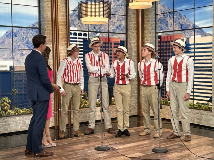 Barbershop singers performing on local news