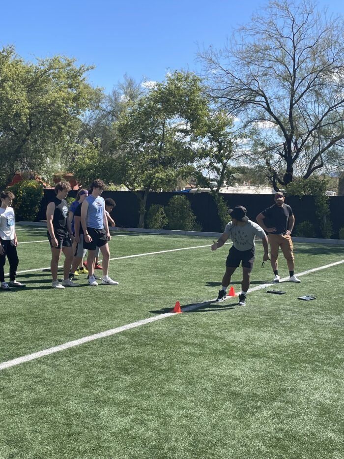 athletes running drills at the Exos combine