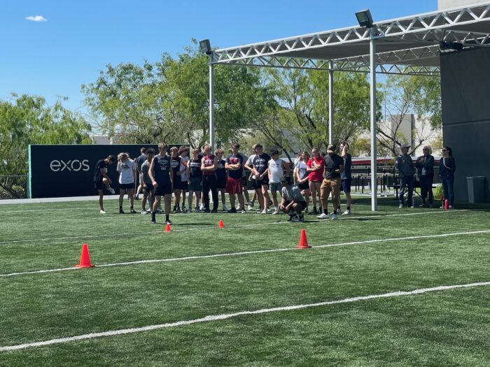 athletes running drills at the Exos combine
