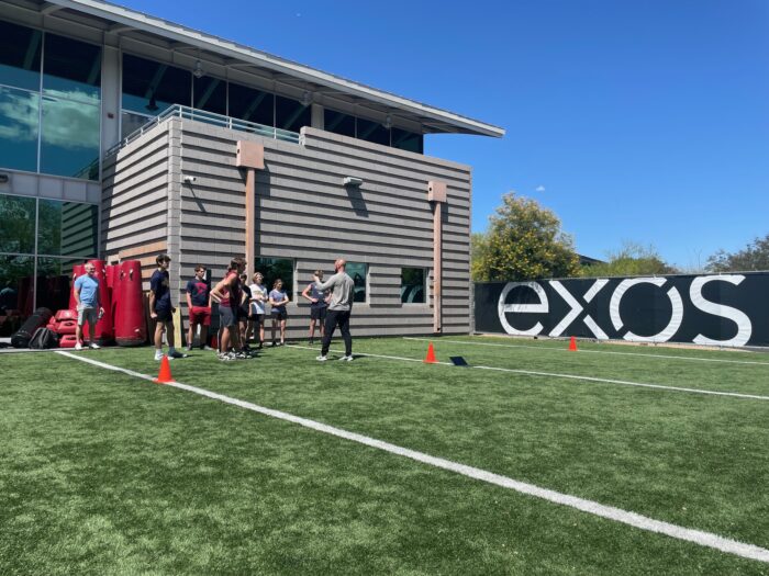 athletes running drills at the Exos combine