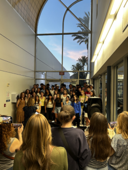 Student choral group performing at Veritas Art Walk