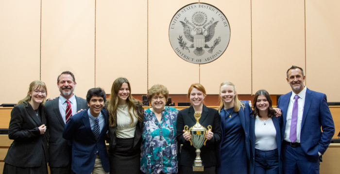 Veritas Prep Mock Trial team photo with trophy