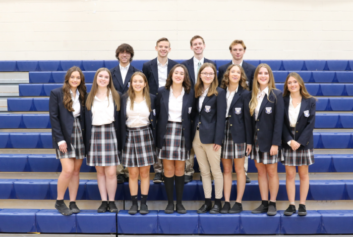 Twelve seniors from Scottsdale Prep standing on bleachers