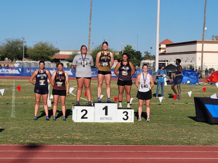 Sofia receiving first place at track meet