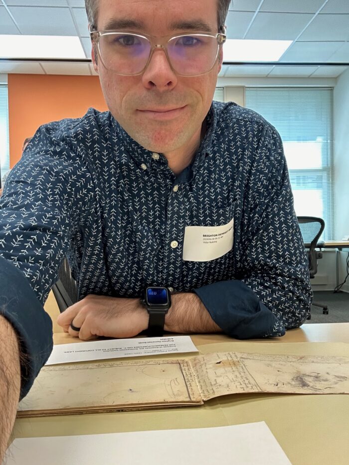 Mr. Demerest-Smith at the Smithsonian American Art Museum looking through the Pelton Papers