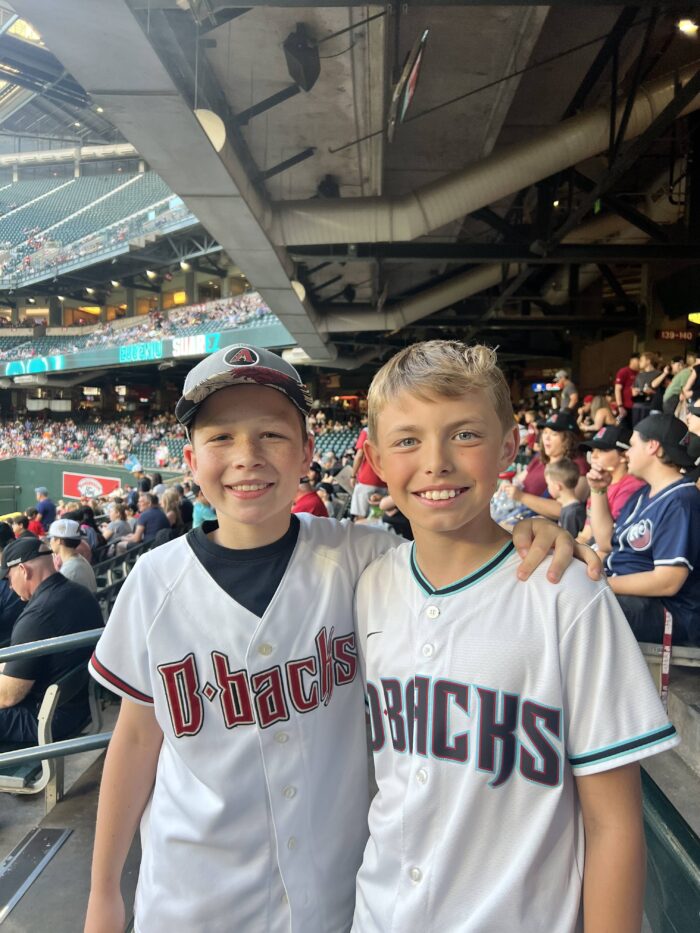 two students wearing D-backs jerseys at Great Hearts Day at Chase Field