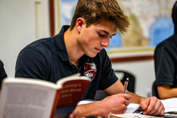 Student taking notes in class