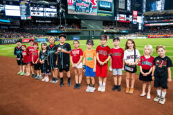 Students on the field at Chase Field.