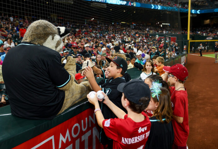 students getting autographs from mascot at Chase Field.