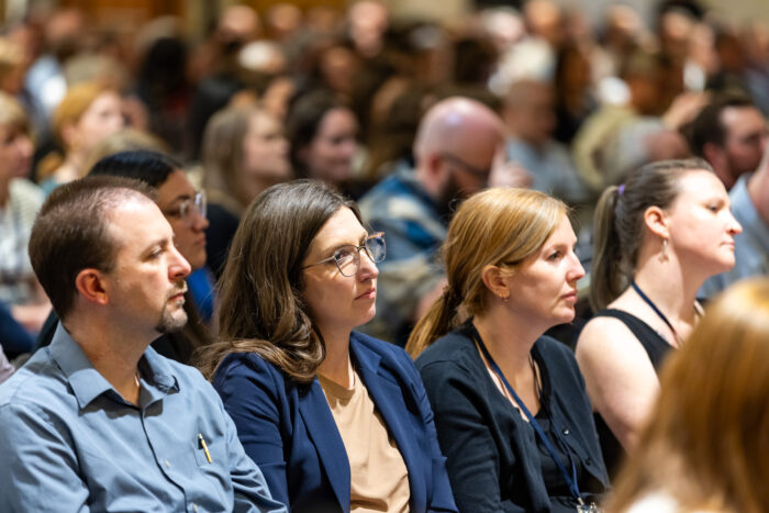 Audience of people seated.