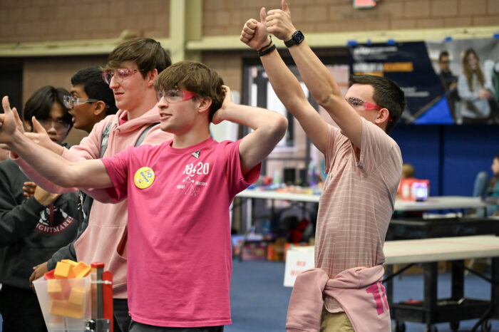 Students cheering at a robotics competition