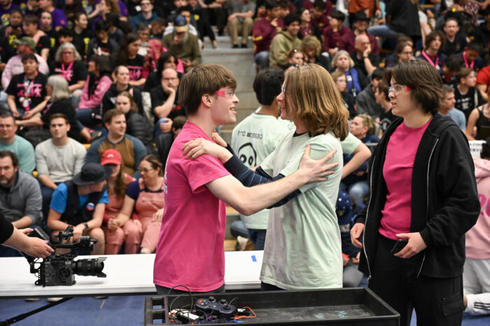 Students cheering at robotics competition