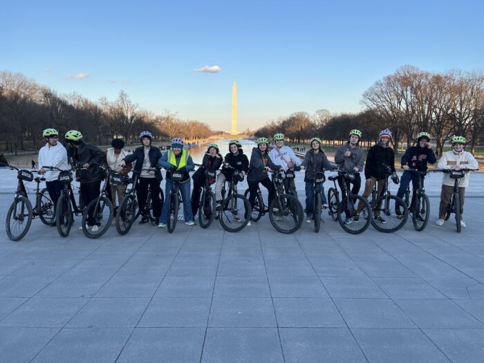Students on bikes in front of the Washington Monument in Washington DC