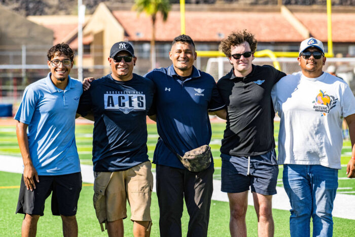 Soccer coaches on a field