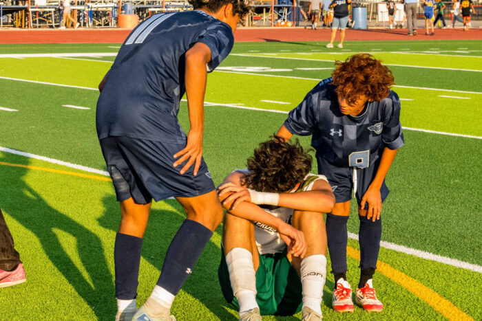 Soccer players celebrating on the field