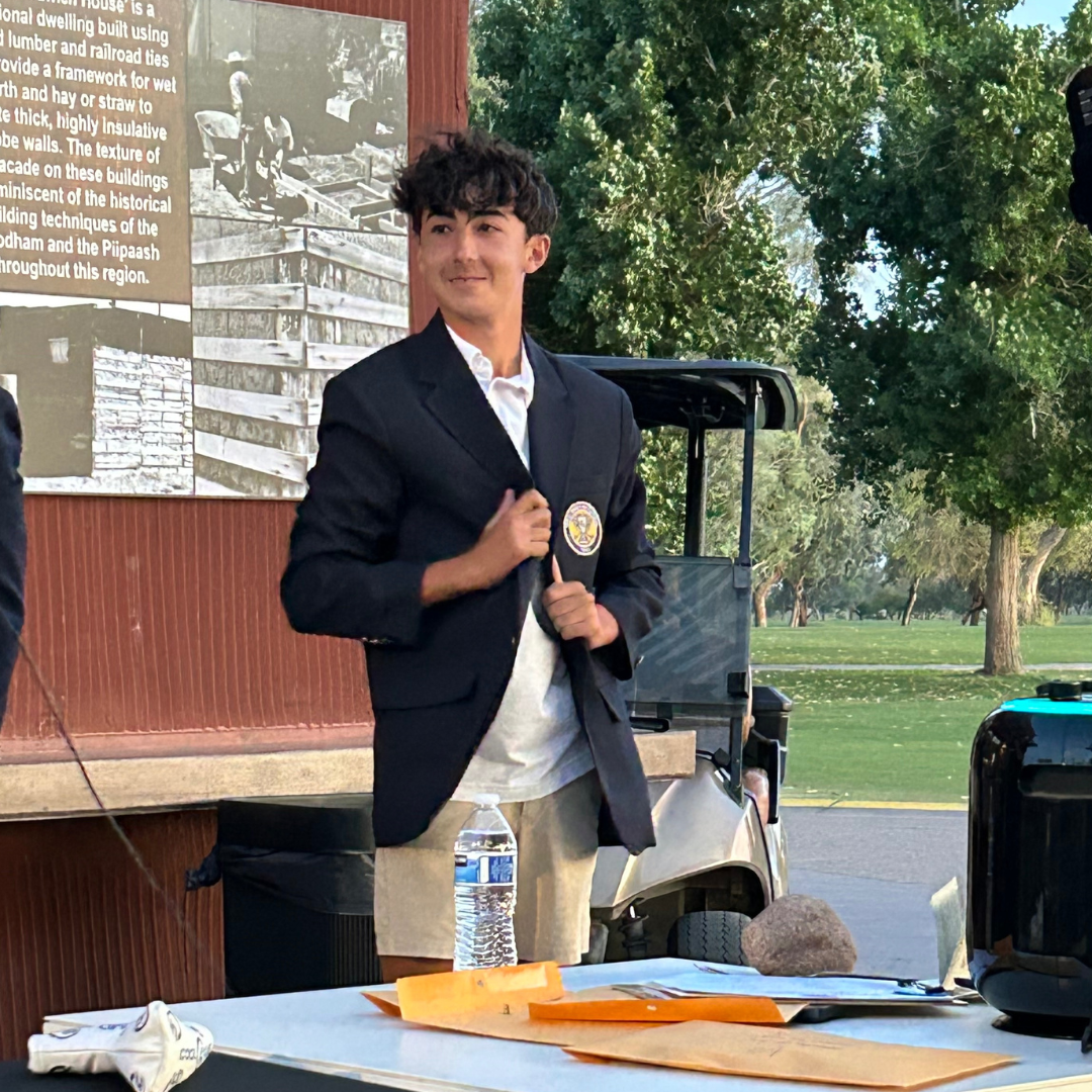 Golf Invitational winner with navy jacket