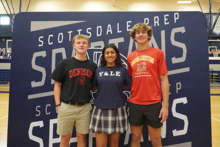 Three student athletes standing together