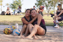 Two beach volleyball players on a sand court