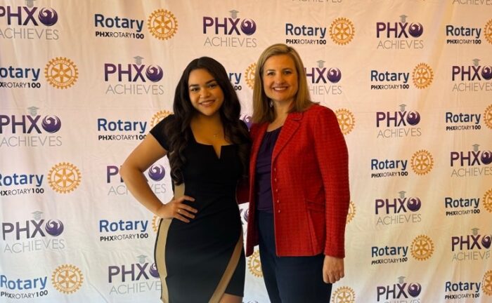 Two-women-standing-together-at-an-awards-luncheon