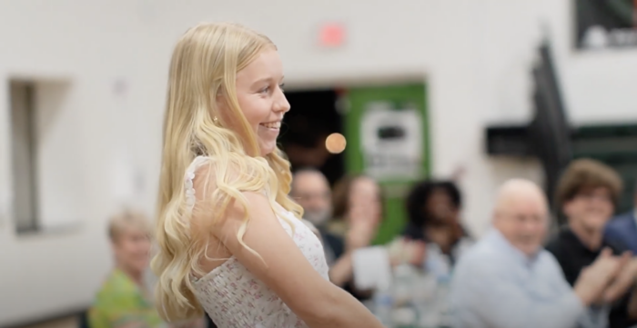 Female student standing to be recognized