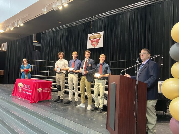 Four Cicero seniors receiving an award