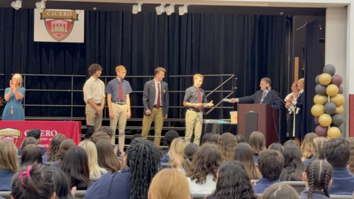 Four Cicero strudents receiving an award on stage