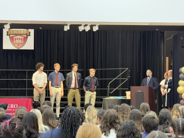 Four Cicero seniors receiving an award