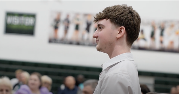 Male student standing to be recognized