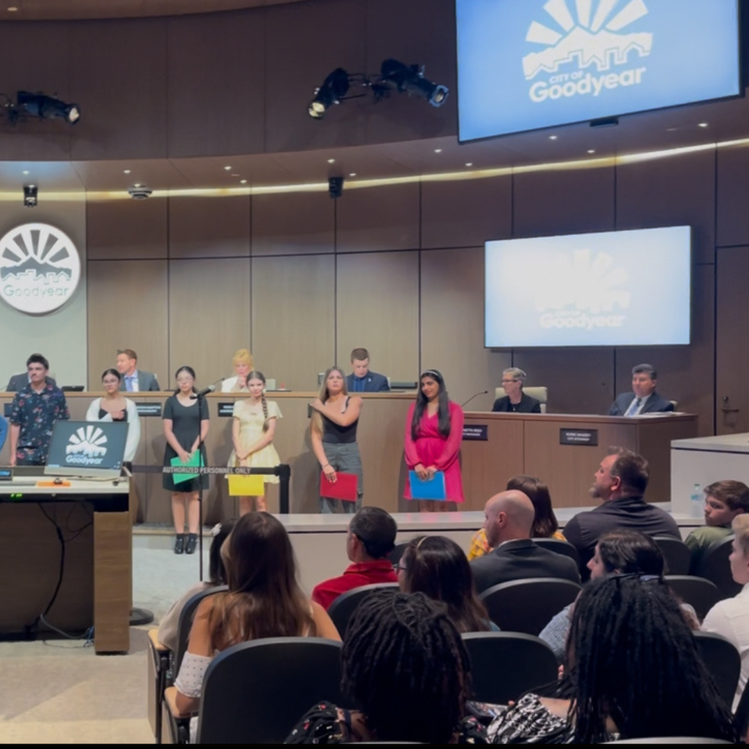 Students standing in city counsel chambers