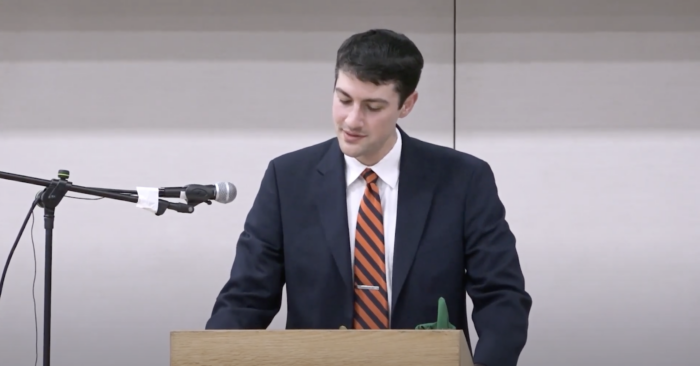 Teacher standing at a podium