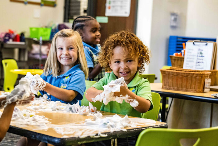 Two Young Hearts students playing with foam