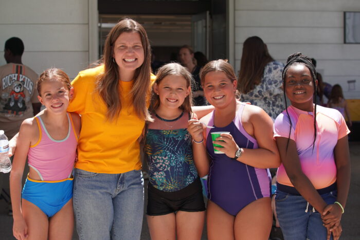 Campus Dean with students at Back to School Bash