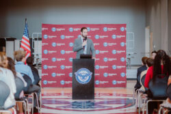 Drew Thomas speaking to a crowd