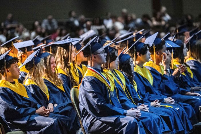 Group of graduates sitting during graduationceremony
