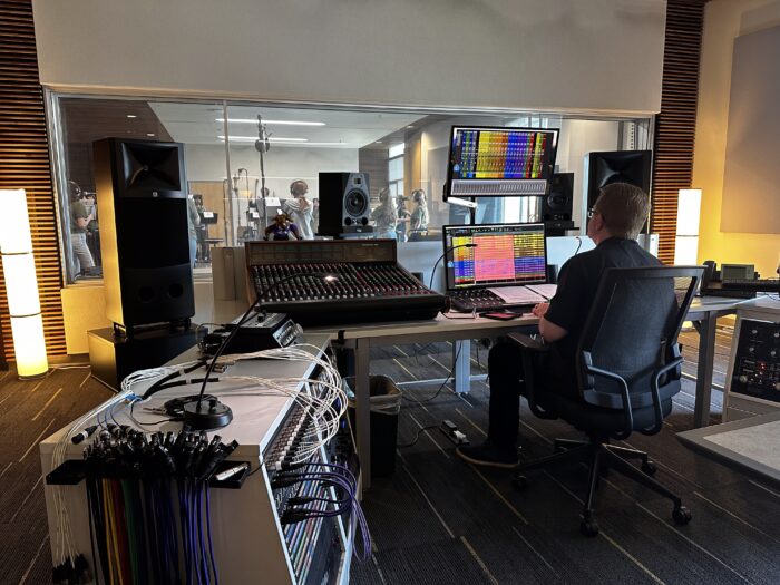 Sound tech outside of a sound booth