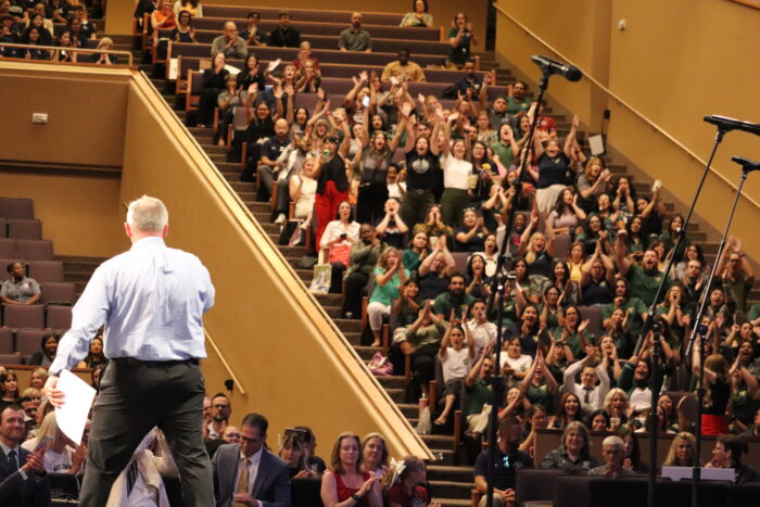 Jon Rickey standing before crowd