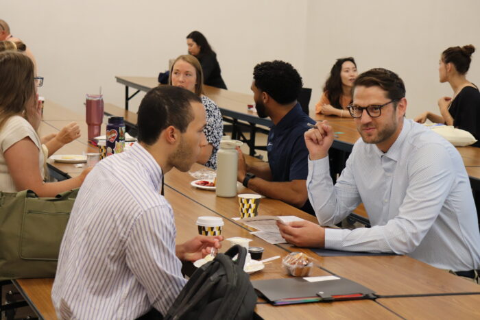 Two Men at Table at NFO