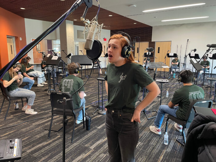 SPA choir student singing in recording studio