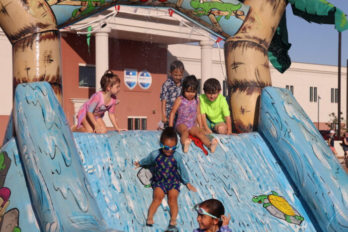 children going down a water slide